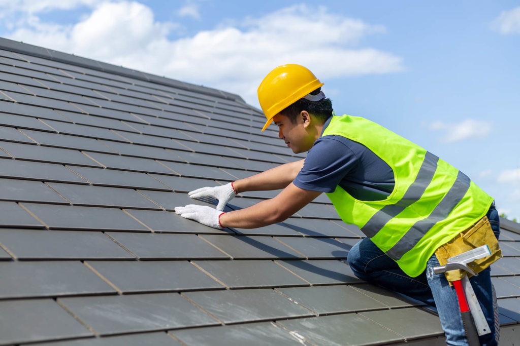bigstock-Roof-Repair-Worker-With-White-247887016-1024x683